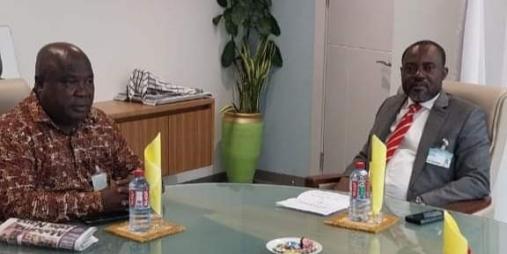 Hon. Mulbah and Hon. Kreku discussing the Technical Agreement